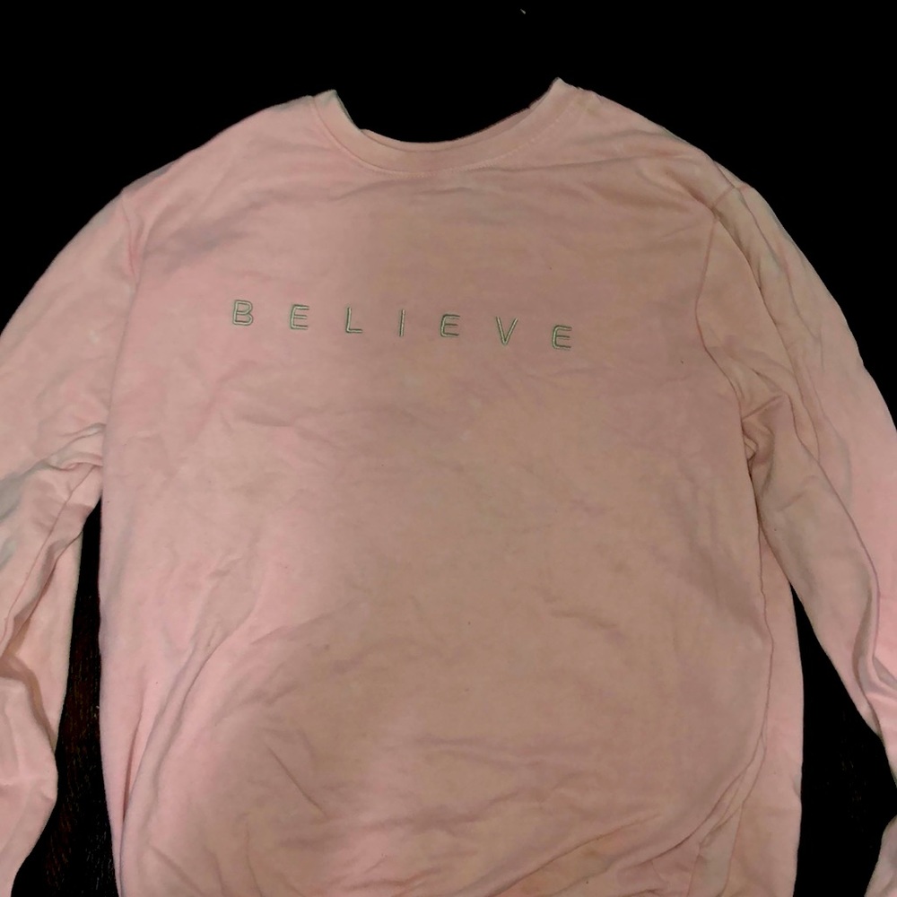 light pink believe sweatshirt